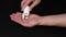 Man Taking Pills into hand, black background