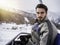 Man taking ride on chairlift while skiing