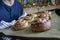 Man taking a trey of cinnamon buns out of the oven