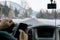Man talking on the phone while driving a car on a slippery snow covered road