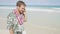 Man talking on smart phone on Hawaii beach