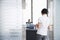 Man Talking To Woman Standing In Office Doorway