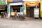 Man with tanned leathery skin rides a three wheeled cargo bike