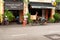 Man with tanned leathery skin rides a three wheeled cargo bike