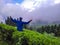 man in tea garden with amazing mountain backgrounds at morning