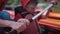 Man teach son how to row in kayak with oars