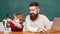 Man teacher play with preschooler child. Homeschooling. Teacher and schoolboy using laptop in class. Young or adult