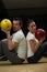 Man Teaching Woman Bowling