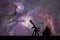 Man with telescope looking at the stars. The Orion Nebula