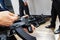 A man tests a machine gun at an exhibition of modern weapons. Charging a pistol to test the performance of a military model.