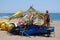 Man thatching a parasol, Benalmadena.