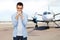 Man thinking over airplane on runway background