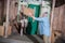 Man throwing cardboard box to wife standing on porch of new house