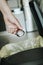 man throwing a coffee capsule to the dustbin