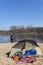 Man Throwing stick into lake