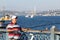 Man throws a fishing rod from the Galata Bridge