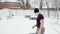 Man throws a rubber tire over himself, man doing crossfit exercises in winter