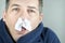 Man With Tissue In Nose