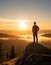 A man on the top of a hill feeling hope, strength, and motivation