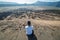 Man on top of Layer Volcanic ash as sand ground of Mount Bromo v