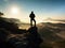 Man on top of mountain. Hiker climbed on peak of rock above foggy valley.