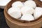 Man Tou, Soft and Hot Chinese steamed rolls serving on traditional bamboo steaming basket