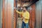 Man touching garage door in storage room