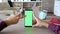 Man touching smartphone screen with chroma mock up on it