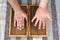 Man touching yoga wooden sadhu board with sharp nails