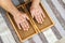 Man touching yoga wooden sadhu board with sharp nails