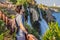 Man tourist on the background of Duden waterfall in Antalya. Famous places of Turkey. Lower Duden Falls drop off a rocky