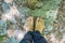 Man tourist climb barefoot the mountain to the Ostrog. It is a tradition to climb barefoot. Monastery of Ostrog, Serbian