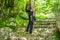 Man tourist climb barefoot the mountain to the Ostrog. It is a tradition to climb barefoot. Monastery of Ostrog, Serbian