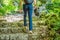 Man tourist climb barefoot the mountain to the Ostrog. It is a tradition to climb barefoot. Monastery of Ostrog, Serbian