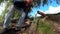 Man tourist dressed in a blue jeans drinking spring water from a pipe