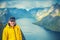 Man tourist standing on a peak of a mount Reinebringen