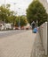 Man tourist street suitcase walking pedestrian trip last mile