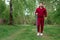 A man in a tracksuit is engaged in Nordic walking. The concept of a healthy lifestyle, cardio training. Copyspace