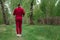 A man in a tracksuit is engaged in Nordic walking. The concept of a healthy lifestyle, cardio training. Copyspace