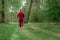 A man in a tracksuit is engaged in Nordic walking. The concept of a healthy lifestyle, cardio training. Copyspace