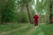 A man in a tracksuit is engaged in Nordic walking. The concept of a healthy lifestyle, cardio training. Copyspace