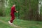 A man in a tracksuit is engaged in Nordic walking. The concept of a healthy lifestyle, cardio training. Copyspace