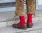 Man in traditional Bavarian leather trousers Lederhosen and red socks