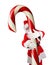 Man is traditional Santa Claus costume with his arms wrapped around a huge Candy Cane