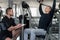 Man Train Chest On Machine With Personal Trainer