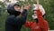 Man trainer instructing woman skydiver before flight into wind tunnel