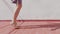 Man training barefoot with a skipping rope on the terrace of his house