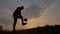 Man is training freestyle bal Hacky On Sunset Sack silhouette freestyle concept. man playing soccer stuffing a ball