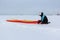 Man training with a kite on a frozen river in the winter, Kama Reservoir, Perm city, Russia