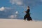 Man training martial arts, iaido, in desert